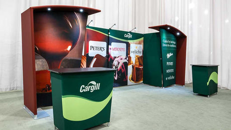 Making a rental exhibit look fully custom: the graphics and lighting choices that erase the rental feel